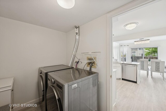 707 Sturnbridge Ln, Schaumburg, IL 60173 - laundry room with separate washer and dryer and light wood finished floors