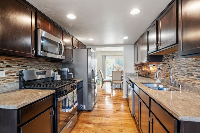641 Sundance Dr, Bolingbrook, IL 60440 - kitchen featuring stainless steel appliances, light wood-style floors, dark brown cabinets, and recessed lighting
