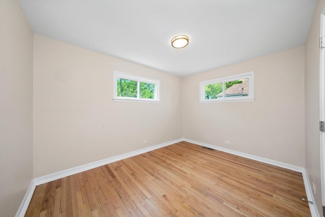 476 W 17th St, Chicago Heights, IL 60411 - spare room with baseboards and light wood-type flooring