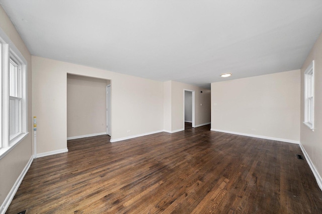 476 W 17th St, Chicago Heights, IL 60411 - empty room with dark wood-style floors and baseboards