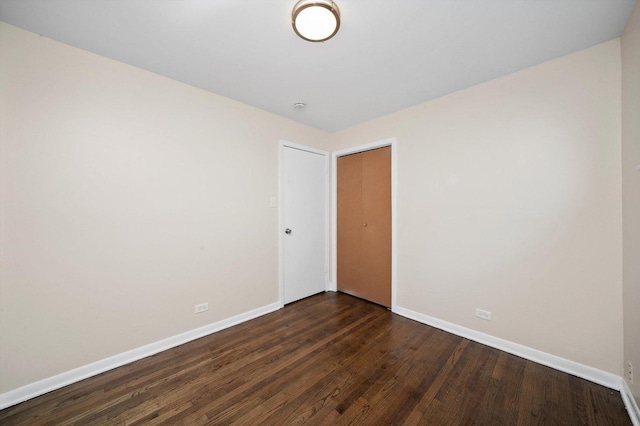 476 W 17th St, Chicago Heights, IL 60411 - empty room featuring dark wood-style flooring and a smoke detector