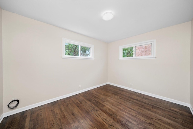 476 W 17th St, Chicago Heights, IL 60411 - empty room with dark wood-type flooring