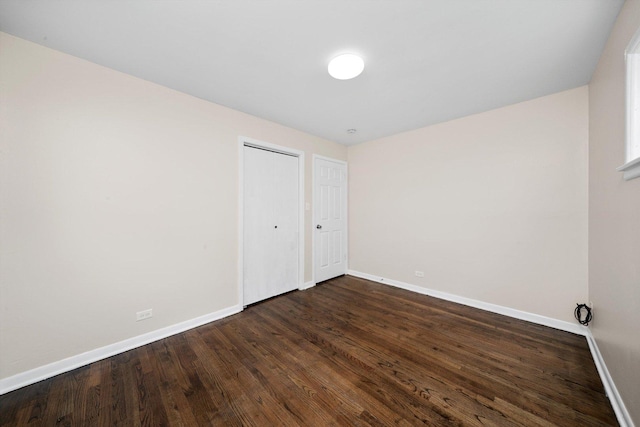 476 W 17th St, Chicago Heights, IL 60411 - unfurnished bedroom with dark wood finished floors and a closet