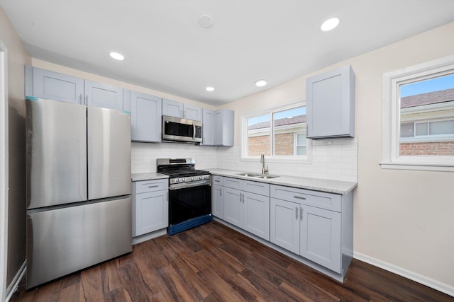 476 W 17th St, Chicago Heights, IL 60411 - kitchen featuring stainless steel appliances, tasteful backsplash, dark wood-style flooring, light stone counters, and recessed lighting