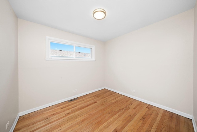 476 W 17th St, Chicago Heights, IL 60411 - empty room featuring baseboards and light wood-type flooring