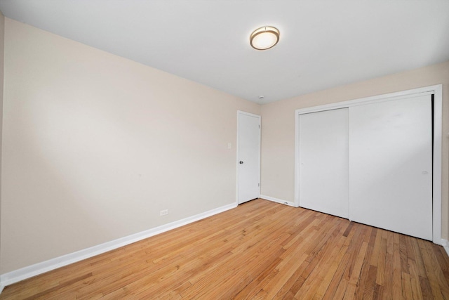 476 W 17th St, Chicago Heights, IL 60411 - unfurnished bedroom with light wood finished floors and a closet