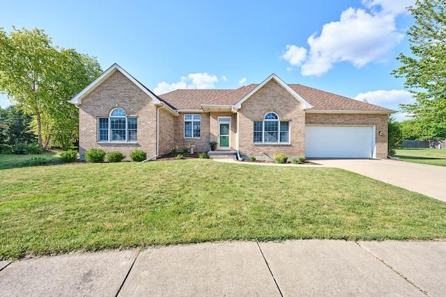 671 Teal Ct, Dekalb, IL 60115 - ranch-style home featuring concrete driveway, an attached garage, brick siding, and a front lawn