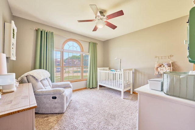 671 Teal Ct, Dekalb, IL 60115 - bedroom with a nursery area, light carpet, and a ceiling fan