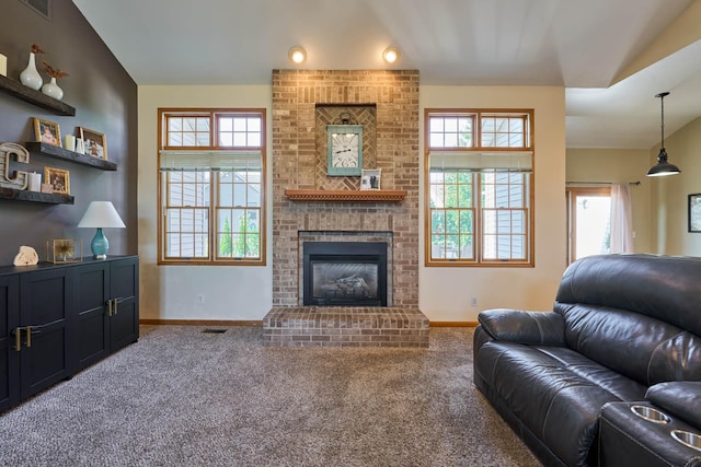 671 Teal Ct, Dekalb, IL 60115 - carpeted living room with baseboards and a fireplace