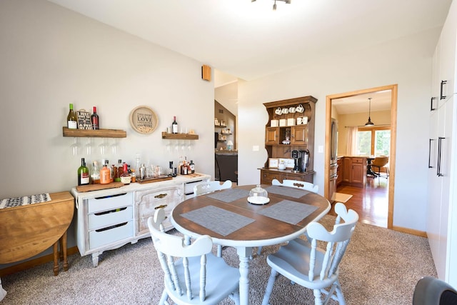 671 Teal Ct, Dekalb, IL 60115 - dining space featuring a dry bar and light colored carpet