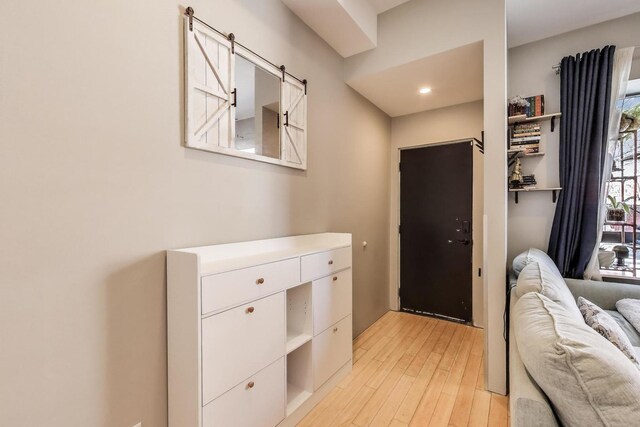 1811 W 17th St Unit 201, Chicago, IL 60608 - entryway with light wood finished floors and a barn door