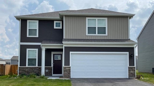 6913 Willow Dr, Wonder Lake, IL 60097 - view of front facade featuring stone siding, driveway, and an attached garage