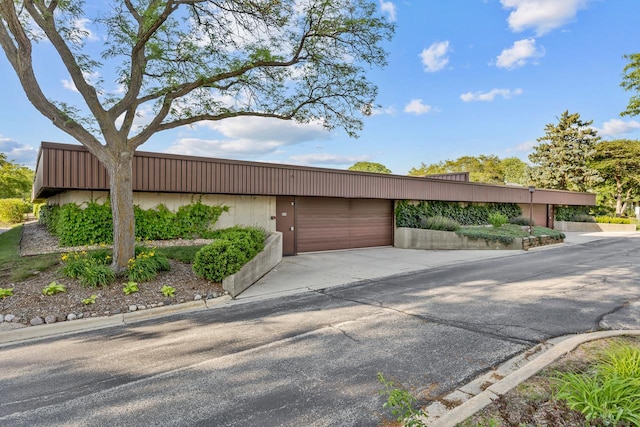 850 Wellington Ave Unit 311, Elk Grove Village, IL 60007 - view of home's exterior with driveway and an attached garage