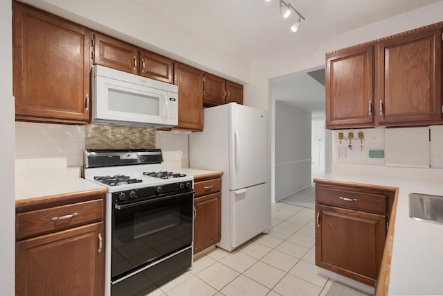 850 Wellington Ave Unit 311, Elk Grove Village, IL 60007 - kitchen featuring white appliances, light countertops, and tasteful backsplash