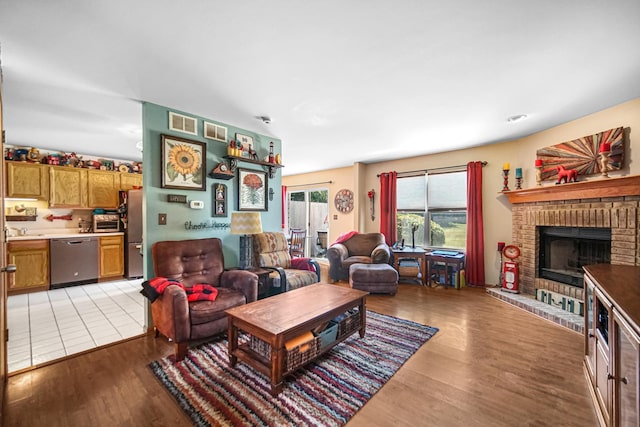 5613 W Von Ave, Monee, IL 60449 - living area with light wood-style flooring and a fireplace