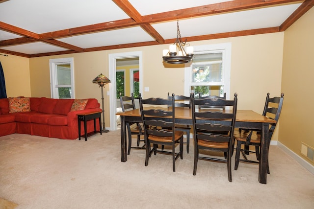 24503 Iroquois Ln, Hudson, IL 61748 - dining space featuring beamed ceiling, a chandelier, light carpet, and coffered ceiling