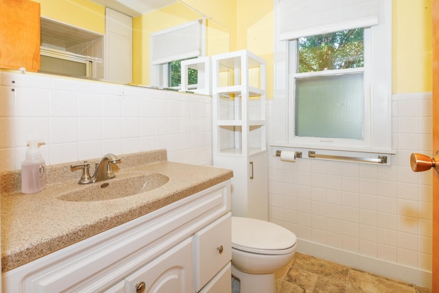 24503 Iroquois Ln, Hudson, IL 61748 - bathroom with tile walls, vanity, and an enclosed shower