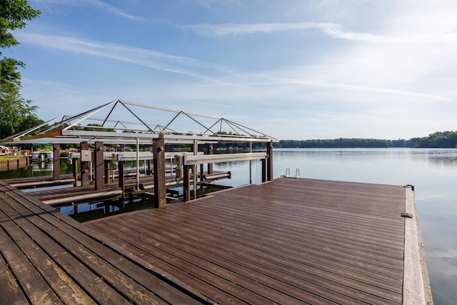 24503 Iroquois Ln, Hudson, IL 61748 - dock featuring boat lift and a water view