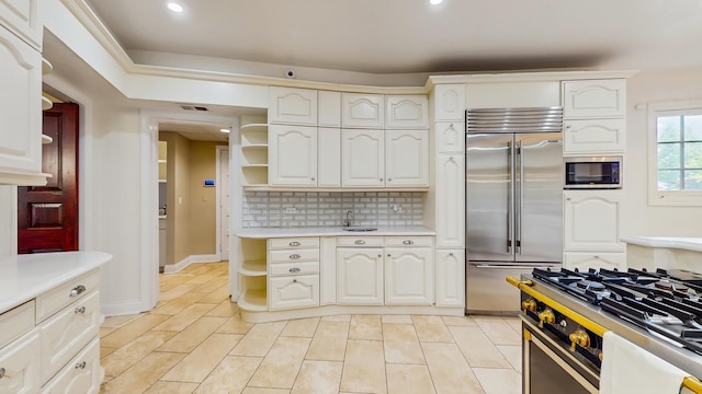 570 Hathaway Cir, Lake Forest, IL 60045 - kitchen featuring built in appliances, open shelves, light countertops, decorative backsplash, and recessed lighting