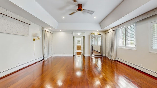 570 Hathaway Cir, Lake Forest, IL 60045 - spare room with a baseboard heating unit, ceiling fan, wood finished floors, and a tray ceiling