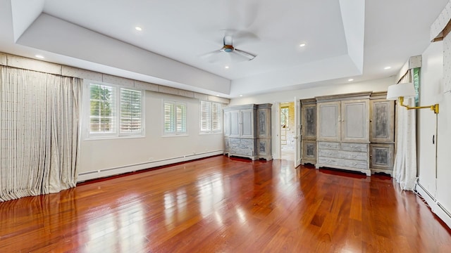 570 Hathaway Cir, Lake Forest, IL 60045 - unfurnished bedroom featuring baseboard heating, wood finished floors, recessed lighting, a raised ceiling, and ceiling fan