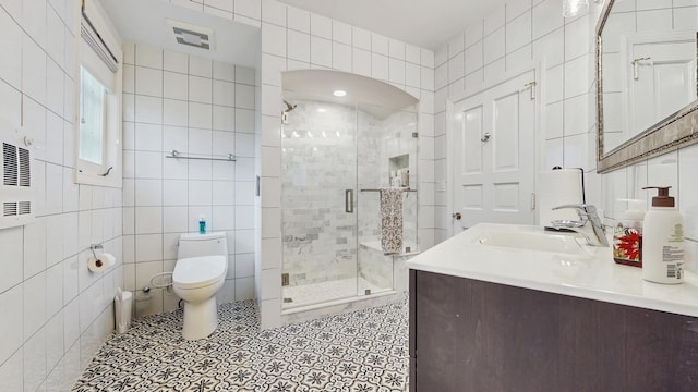 570 Hathaway Cir, Lake Forest, IL 60045 - bathroom with tile walls, a shower stall, and vanity