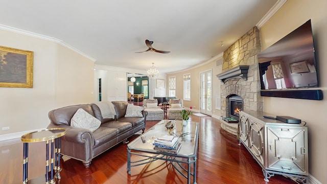 570 Hathaway Cir, Lake Forest, IL 60045 - living area featuring ornamental molding, dark wood-style floors, a stone fireplace, a chandelier, and a ceiling fan