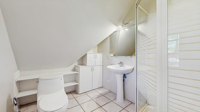 570 Hathaway Cir, Lake Forest, IL 60045 - bathroom featuring vaulted ceiling, tile patterned floors, and a shower