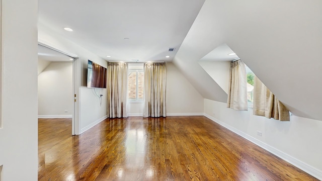 570 Hathaway Cir, Lake Forest, IL 60045 - additional living space featuring healthy amount of natural light, wood finished floors, recessed lighting, and vaulted ceiling