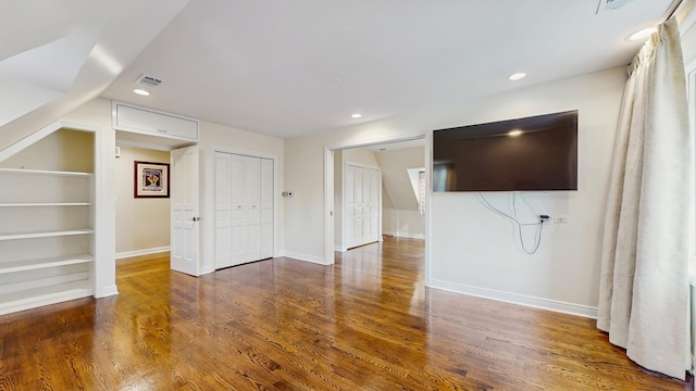 570 Hathaway Cir, Lake Forest, IL 60045 - unfurnished living room with built in shelves, wood finished floors, and recessed lighting