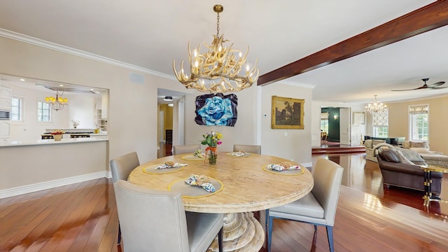 570 Hathaway Cir, Lake Forest, IL 60045 - dining area with a chandelier, hardwood / wood-style flooring, crown molding, and ceiling fan