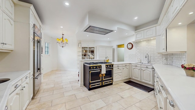 570 Hathaway Cir, Lake Forest, IL 60045 - kitchen with high quality appliances, backsplash, a chandelier, light countertops, and recessed lighting