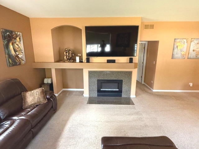 1711 Devonshire Ln, Shorewood, IL 60404 - living area with carpet and a fireplace with flush hearth