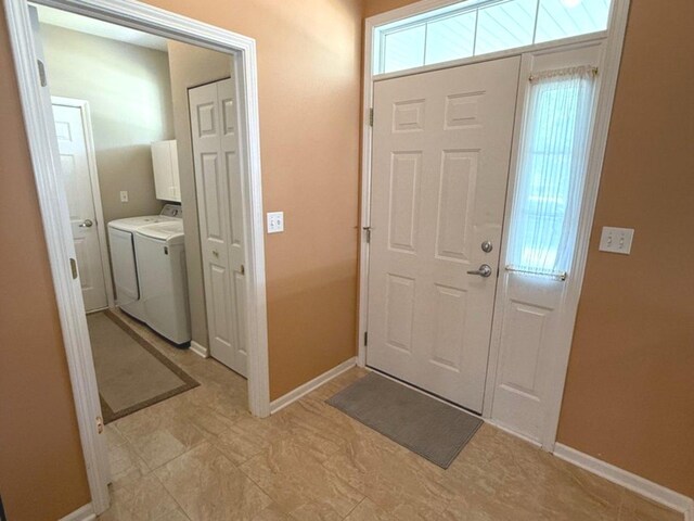 1711 Devonshire Ln, Shorewood, IL 60404 - foyer entrance with baseboards and separate washer and dryer