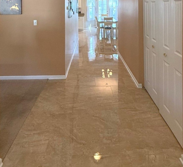 1711 Devonshire Ln, Shorewood, IL 60404 - corridor featuring baseboards and light marble finish flooring