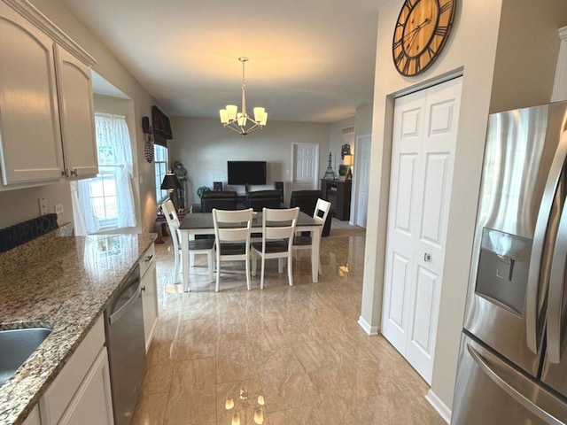 1711 Devonshire Ln, Shorewood, IL 60404 - dining room with a chandelier and light marble finish flooring