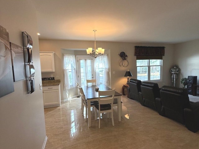 1711 Devonshire Ln, Shorewood, IL 60404 - dining area featuring a chandelier and baseboards