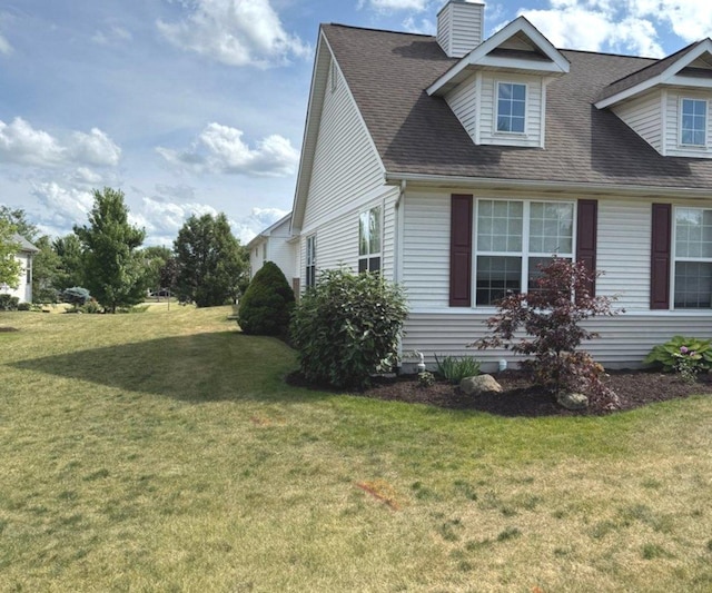 1711 Devonshire Ln, Shorewood, IL 60404 - view of side of property with a lawn, a chimney, and a shingled roof