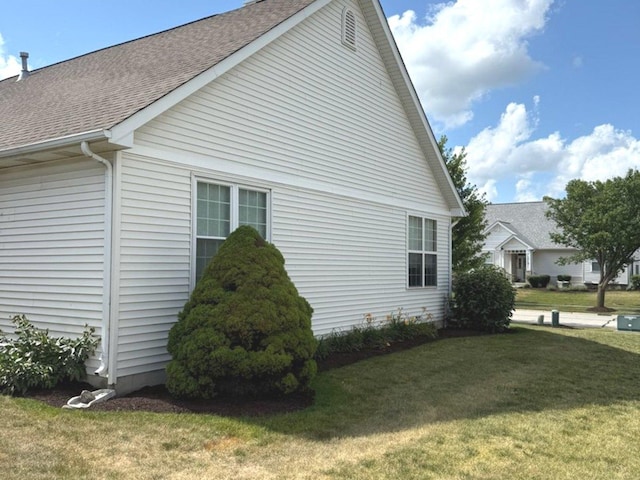 1711 Devonshire Ln, Shorewood, IL 60404 - view of side of home featuring roof with shingles and a yard