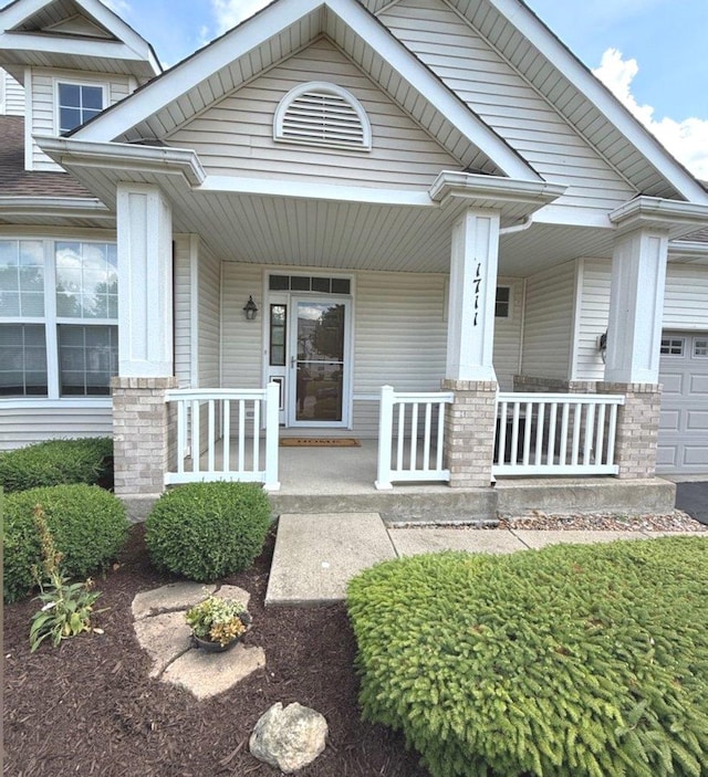 1711 Devonshire Ln, Shorewood, IL 60404 - view of front of property featuring a porch and an attached garage