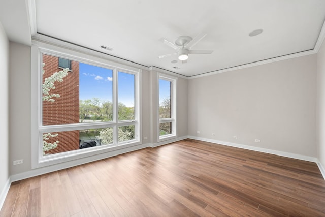 2864 N Riverwalk Dr, Chicago, IL 60618 - unfurnished room featuring ornamental molding, ceiling fan, and wood finished floors