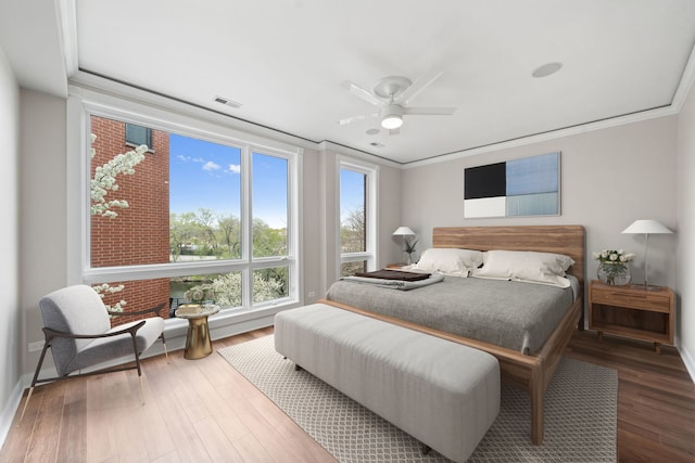 2864 N Riverwalk Dr, Chicago, IL 60618 - bedroom with wood finished floors, ornamental molding, and ceiling fan
