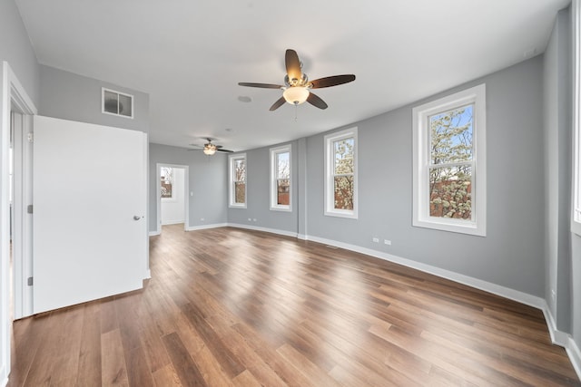 2864 N Riverwalk Dr, Chicago, IL 60618 - unfurnished room featuring ceiling fan and wood finished floors