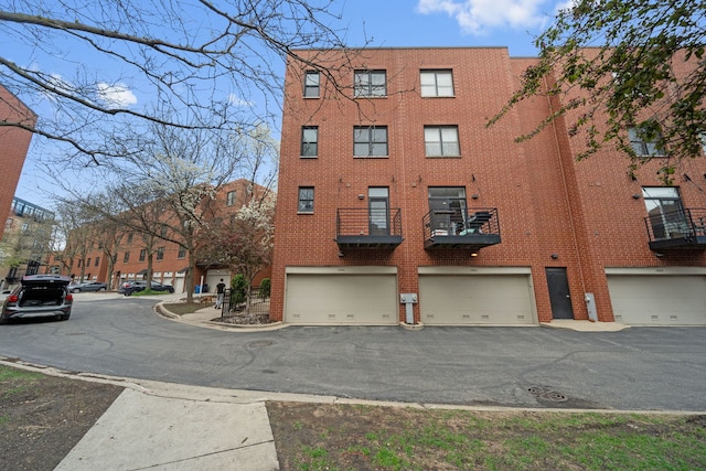 2864 N Riverwalk Dr, Chicago, IL 60618 - view of property with an attached garage and driveway