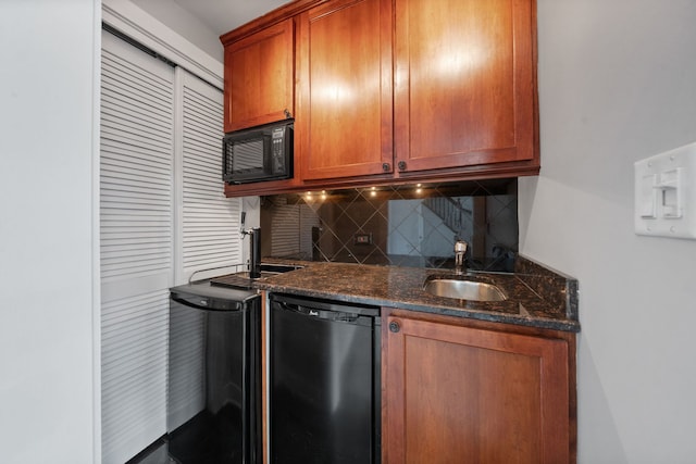2864 N Riverwalk Dr, Chicago, IL 60618 - kitchen with black appliances, decorative backsplash, brown cabinets, and dark stone countertops