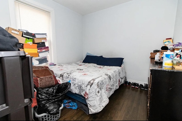 5523 W Huron St, Chicago, IL 60644 - bedroom featuring wood finished floors and multiple windows