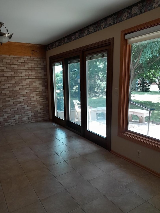 154 E US Highway 34, Mendota, IL 61342 - doorway with plenty of natural light, tile patterned flooring, and brick wall