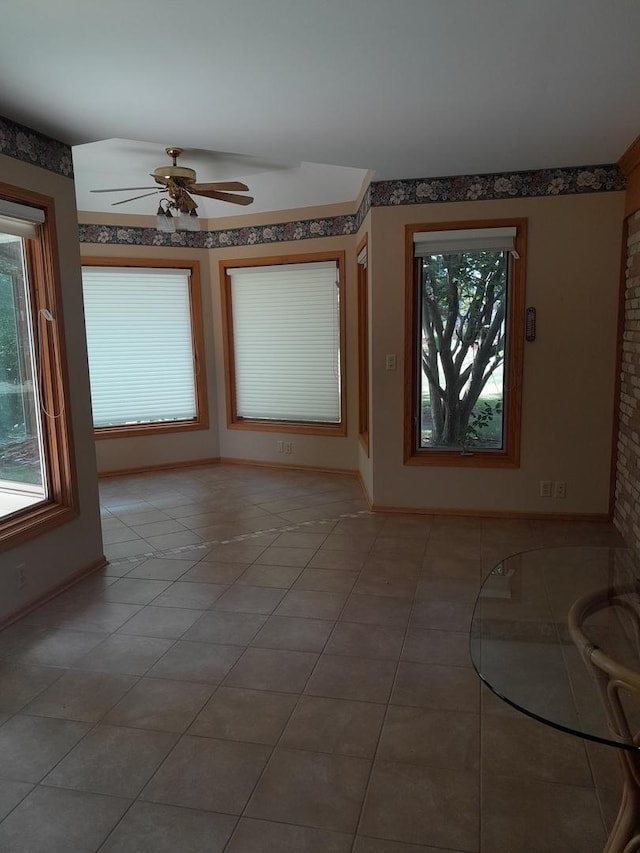 154 E US Highway 34, Mendota, IL 61342 - tiled empty room with ceiling fan and baseboards