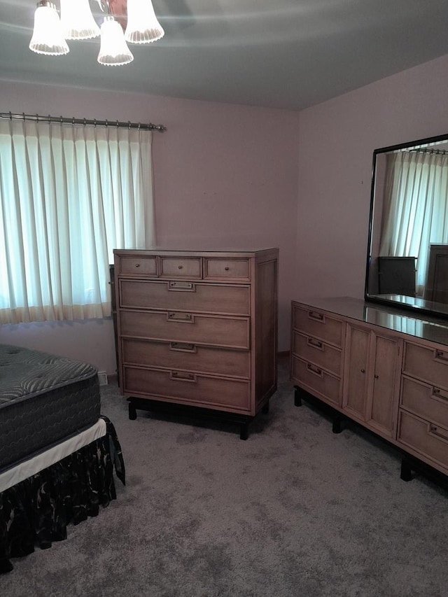 154 E US Highway 34, Mendota, IL 61342 - bedroom with light carpet and a chandelier