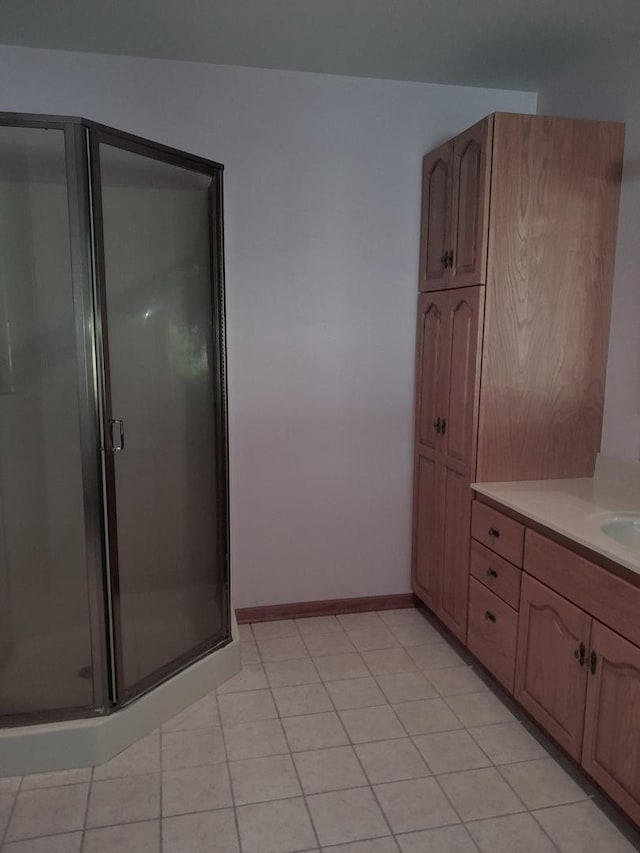 154 E US Highway 34, Mendota, IL 61342 - bathroom with a stall shower, vanity, and tile patterned floors